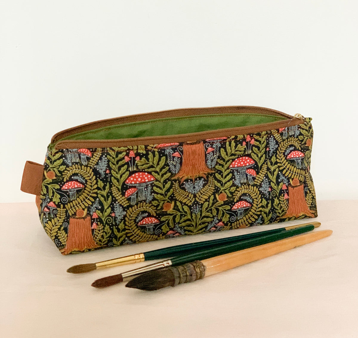 Artist supply brush case with forest fabric print