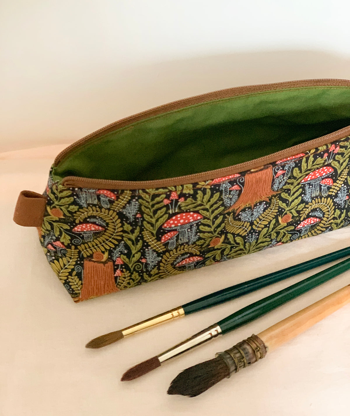Artist supply brush case with forest fabric print