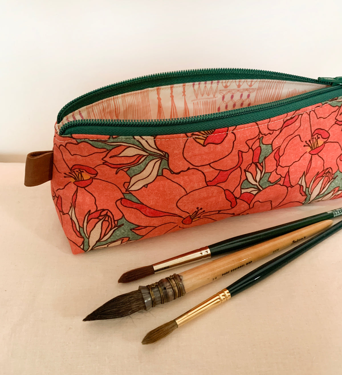 Artist supply brush case with red floral print