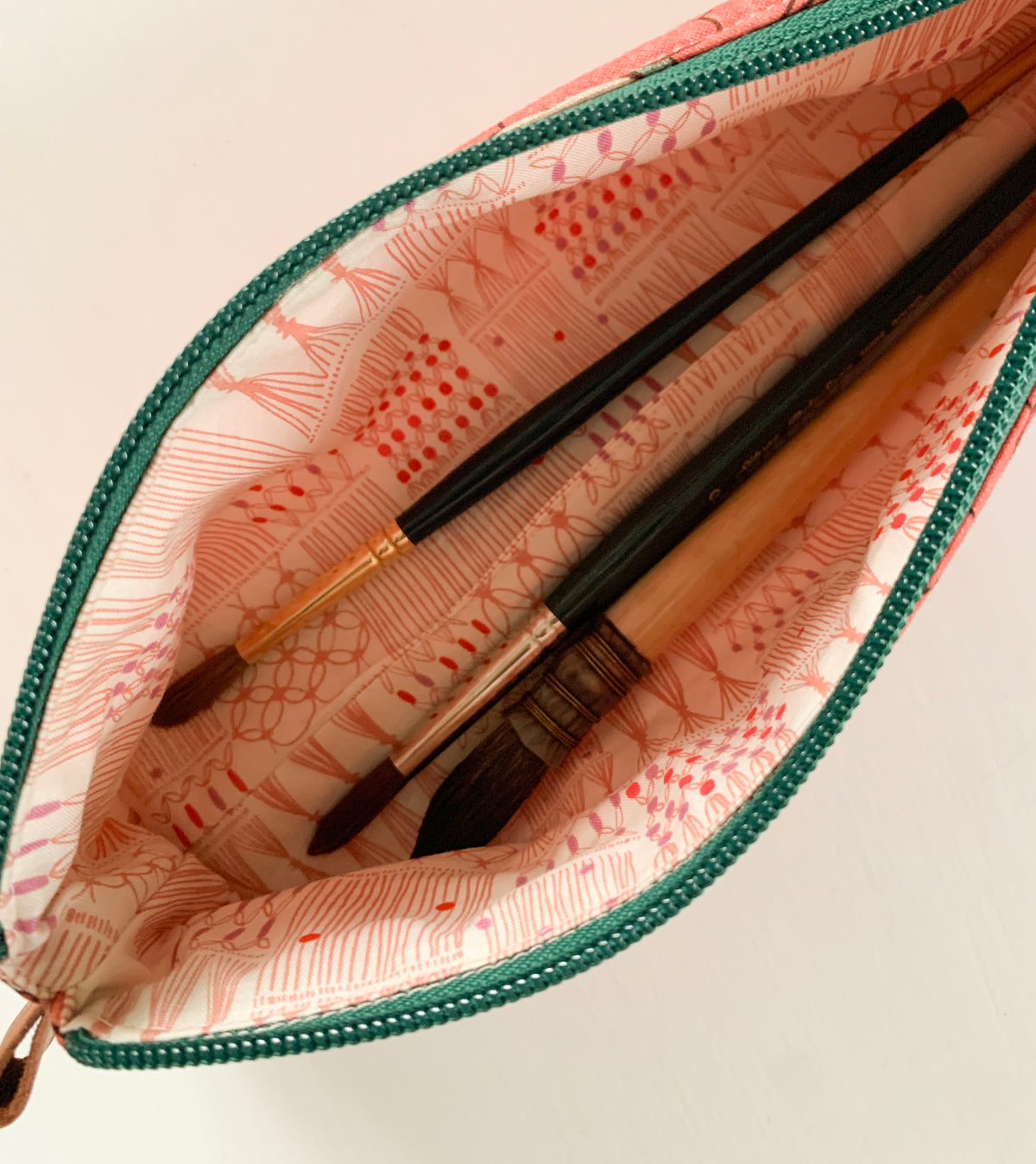 Artist supply brush case with red floral print