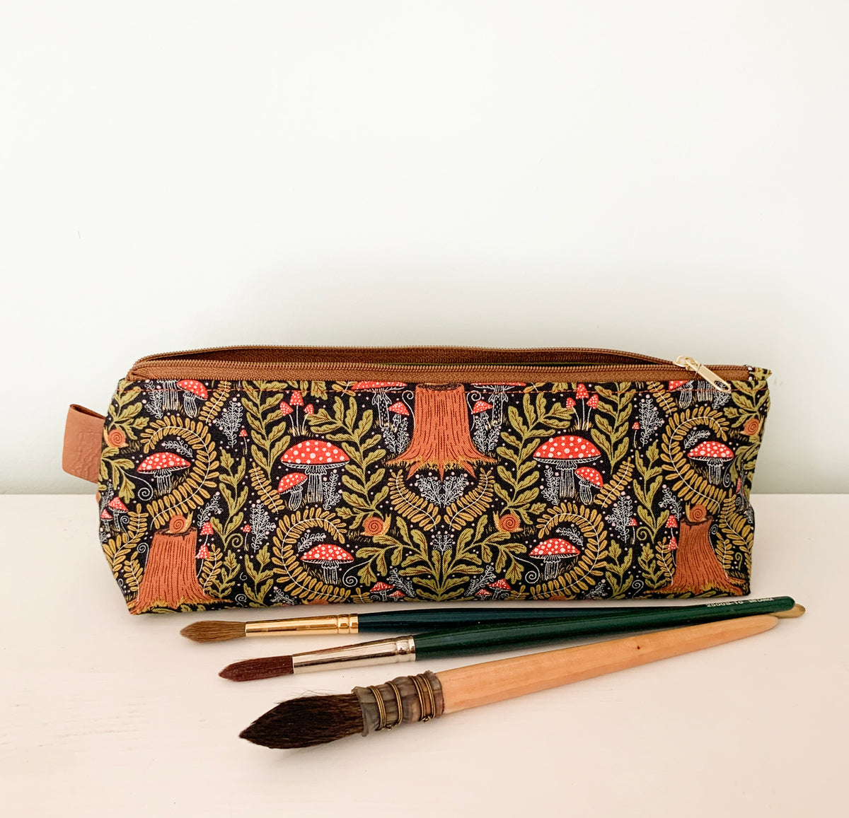 Artist supply brush case with forest fabric print