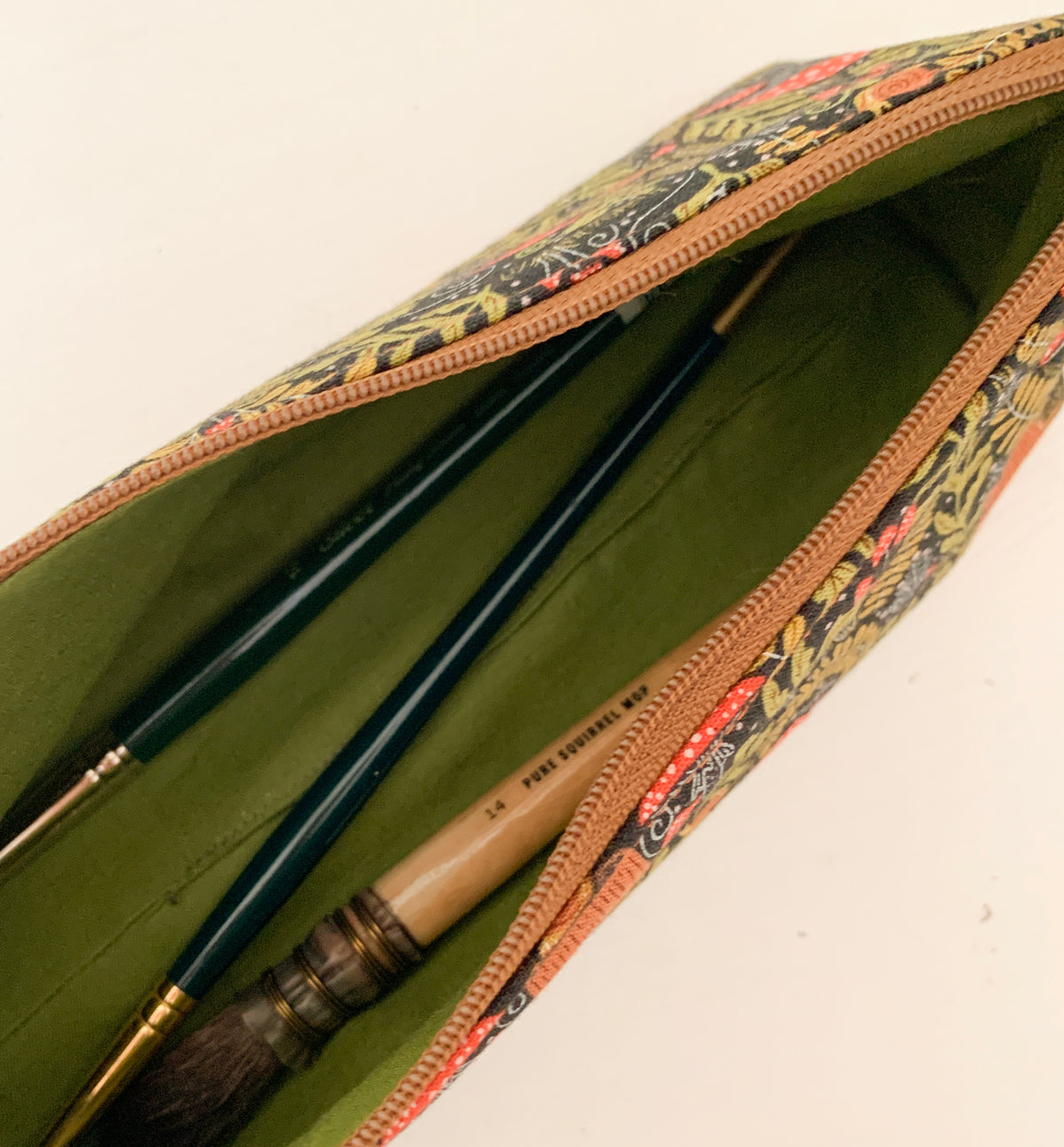 Artist supply brush case with forest fabric print