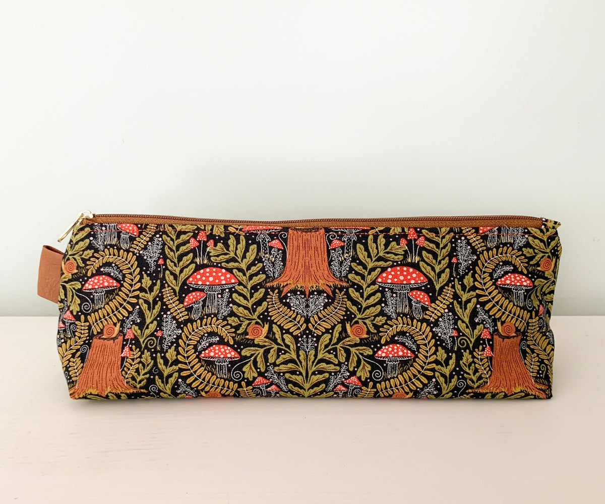 Artist supply brush case with forest fabric print