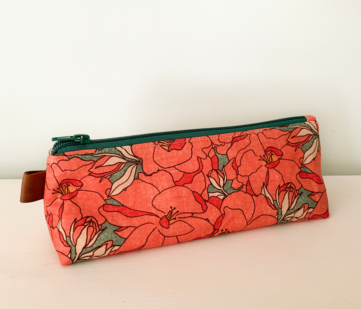 Artist supply brush case with red floral print