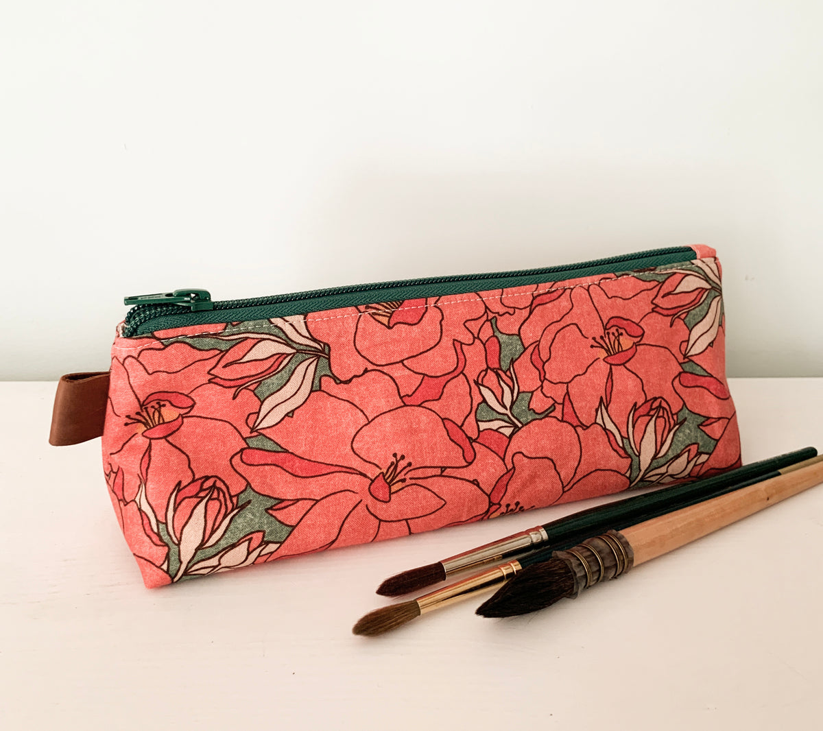 Artist supply brush case with red floral print