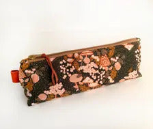 Artist brush case with autumn mushrooms print.