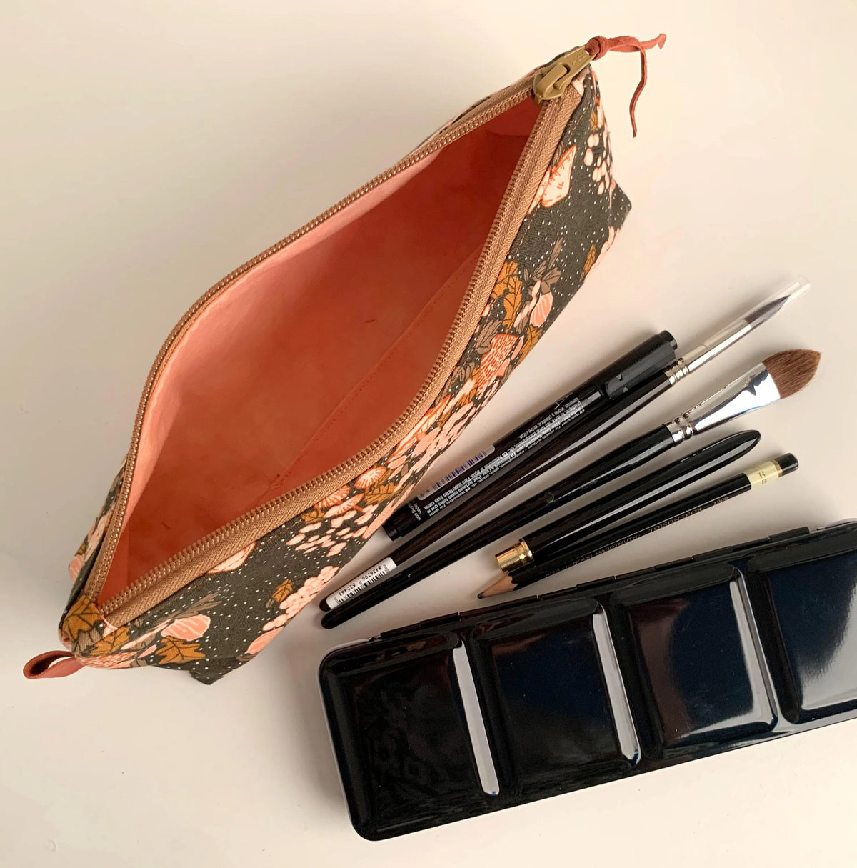 Artist brush case with autumn mushrooms print.
